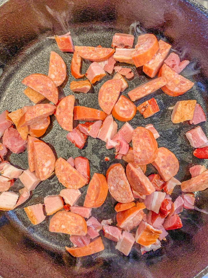 chopped bacon and sausage in a  pan