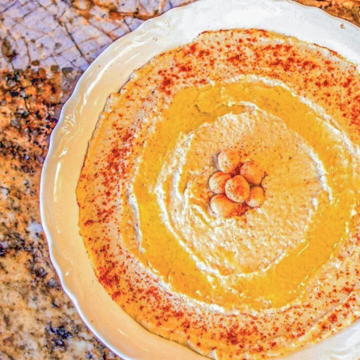 hummus in a white plate