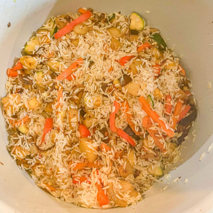 rice and veggies in an instant pot for vegan biryani