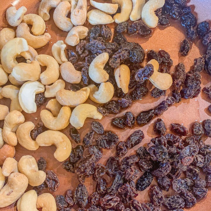 raisins and cashews in a  skillet