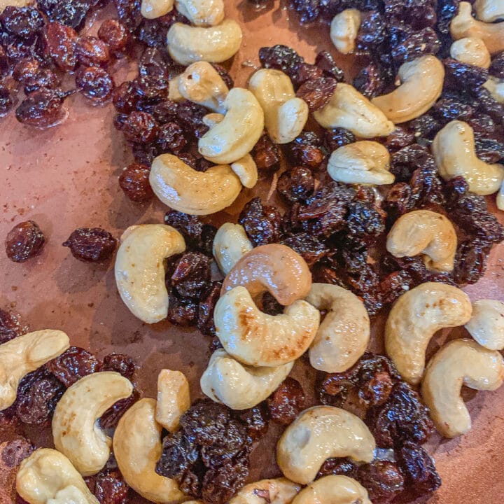 toaste raisins and cashews in a  skillet