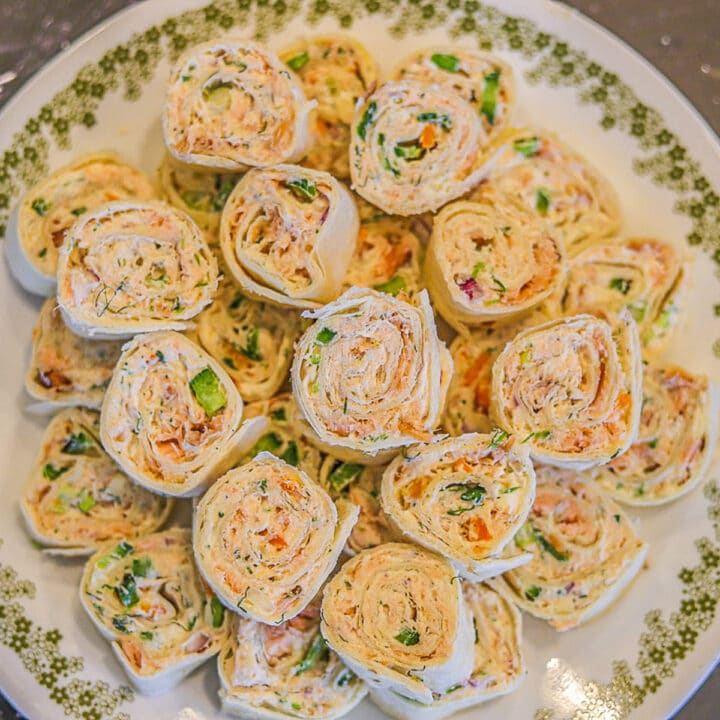 New Years eve appetizers: salmon pinwheels on a white plate
