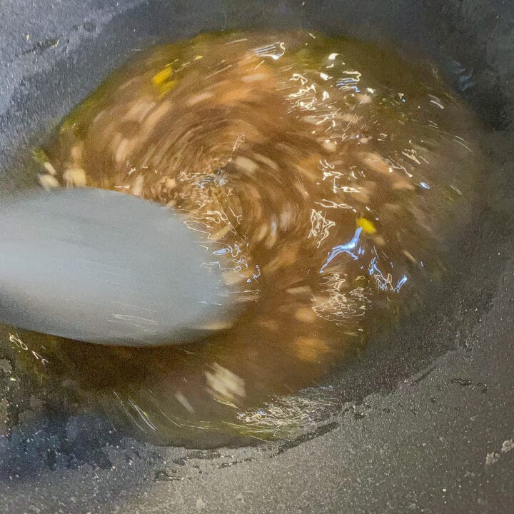stirring ingredients in a pan