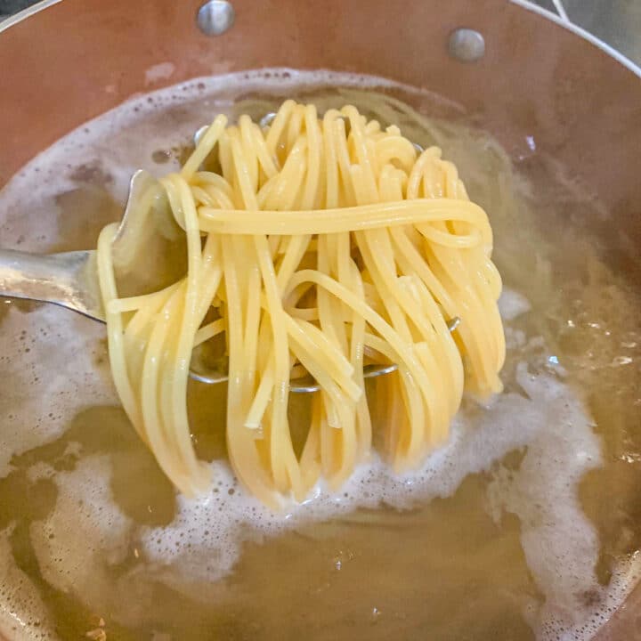removing pasta from boiling water