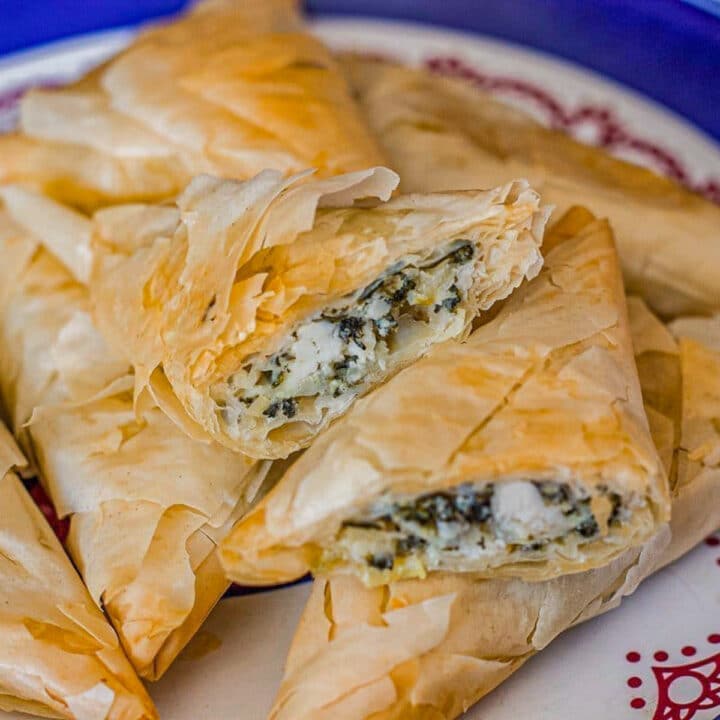 New Years eve appetizers: spanakopita stacked on a plate