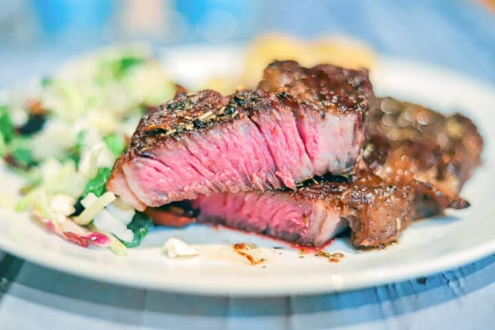 pink steak sliced on a white plate