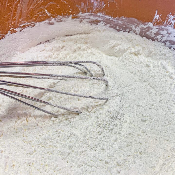 powdered sugar being whisked in a pot