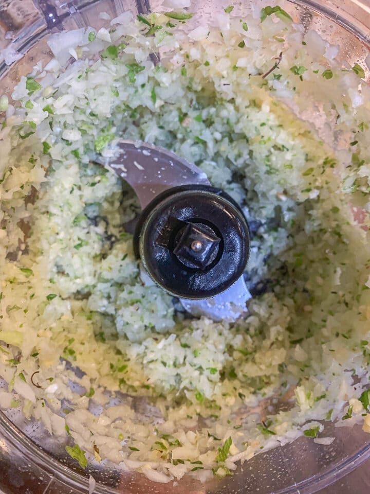 finely ground onions, peppers, and spices in a food processor