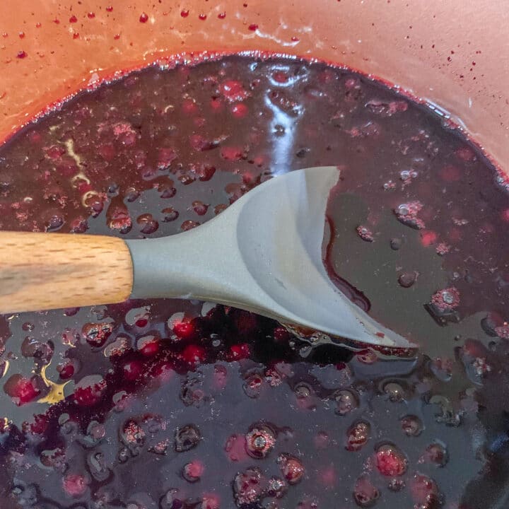 mixing berries in pot