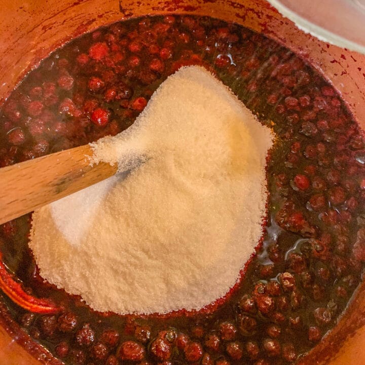stirring sugar into berries