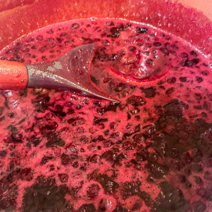 berries being stirred in pot