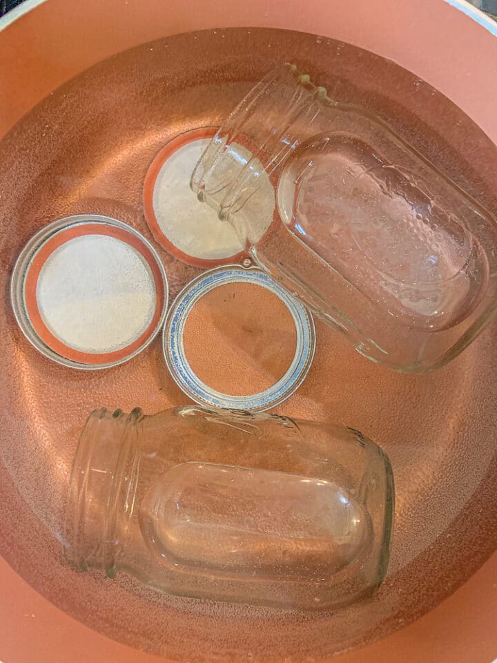 sterilizing jars and lids in a pot 