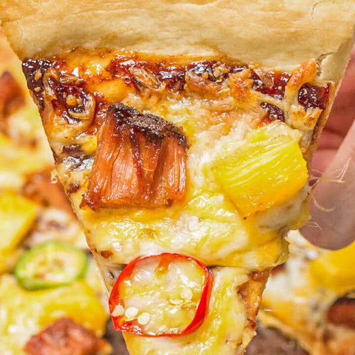 sliced pizza with pineapple and pork