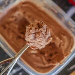 Nutella ice cream being scooped out of tub