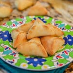 spinach fatayer (turnovers) on a green and blue plate