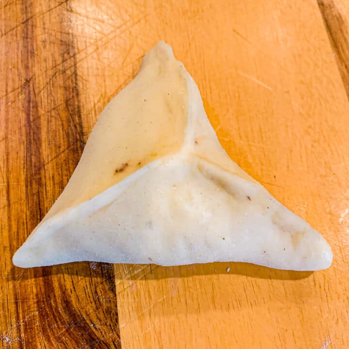 uncooked fatayer on a cutting board