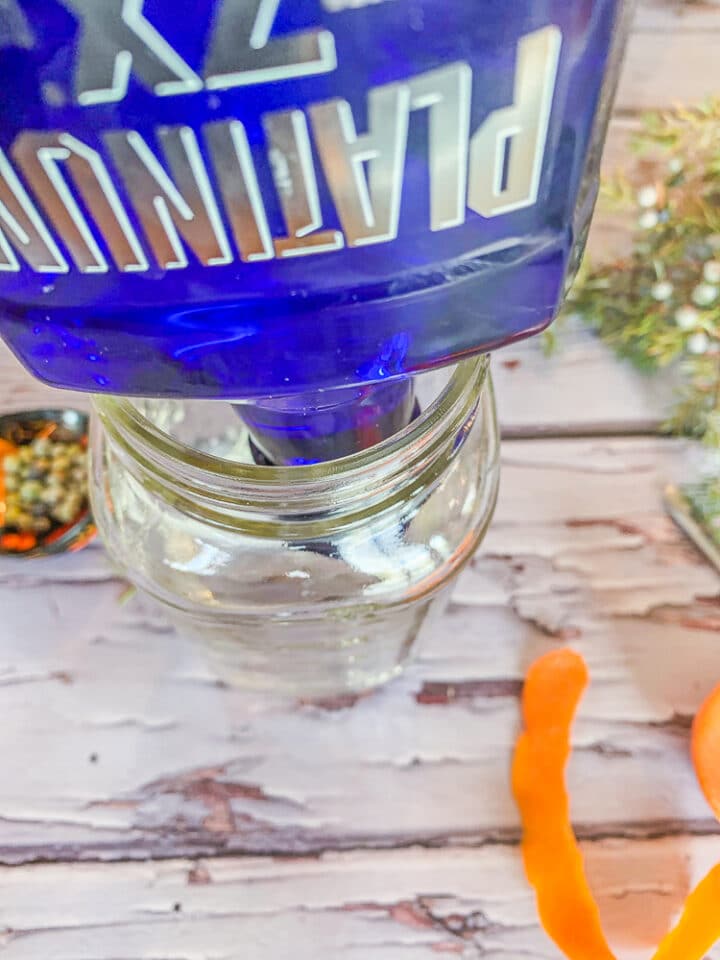 pouring vodka in a jar