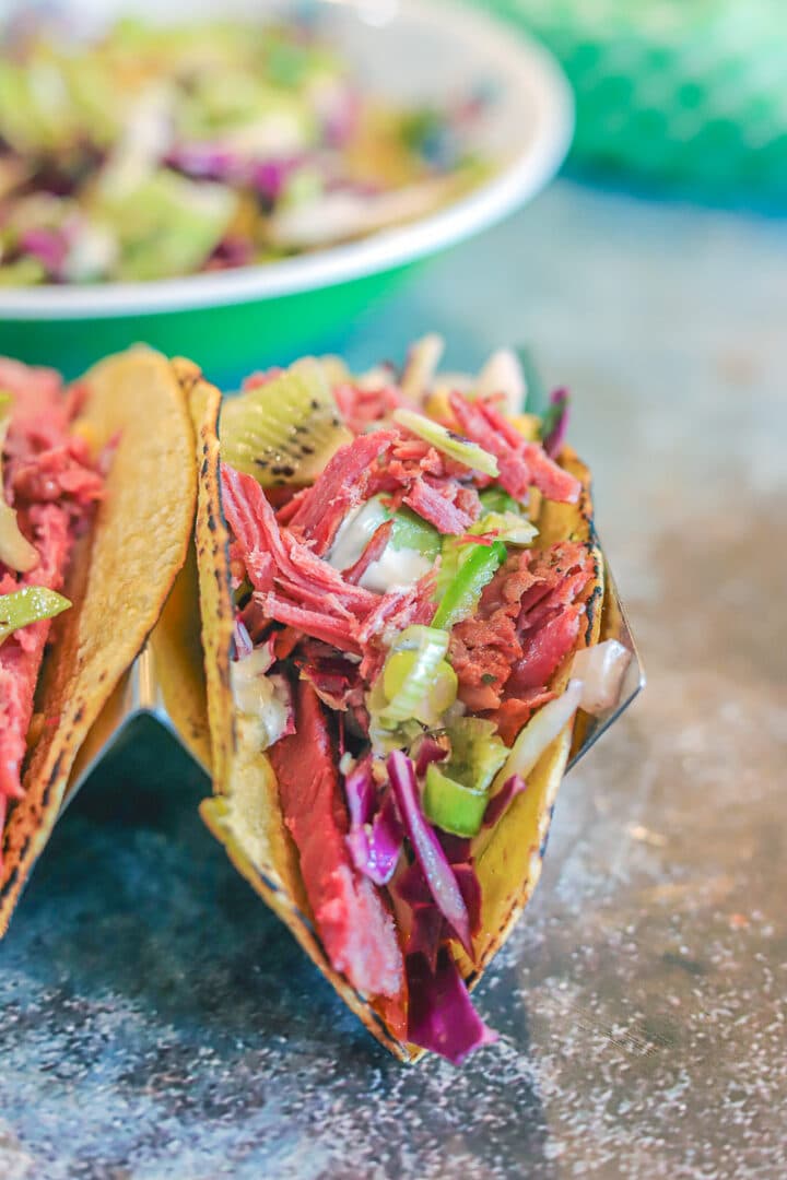 corned beef irish tacos with slaw in the background