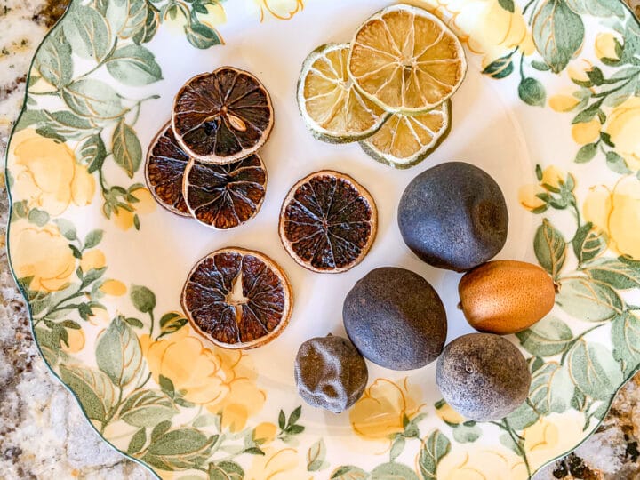 a plate full of dried lime slices and dried limes