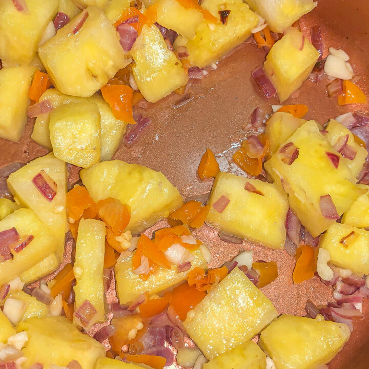 pineapple chutney being cooked in a pan