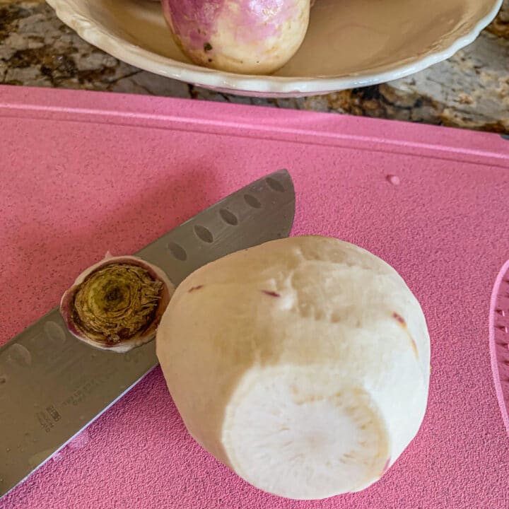 trimmed turnip on a cutting board