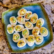 healthy deviled eggs on a blue plate