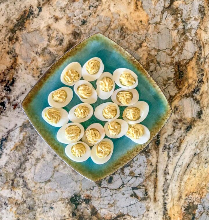healthy Keto deviled eggs on a blue plate
