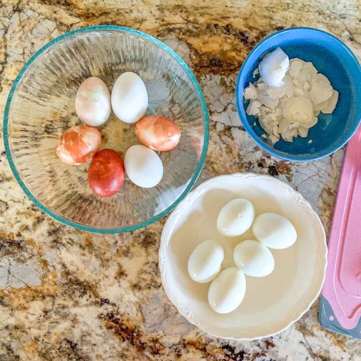 boiled eggs being peeled