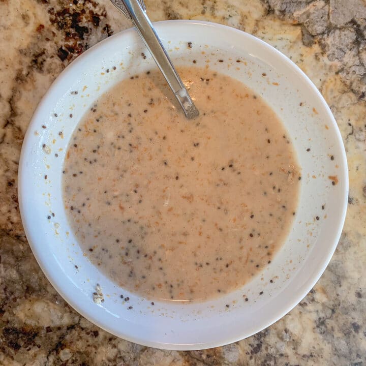 making protein overnight oats in a white bowl 3