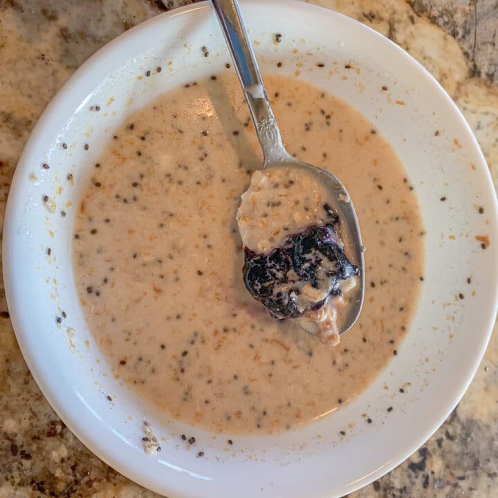 making protein overnight oats in a white bowl 2