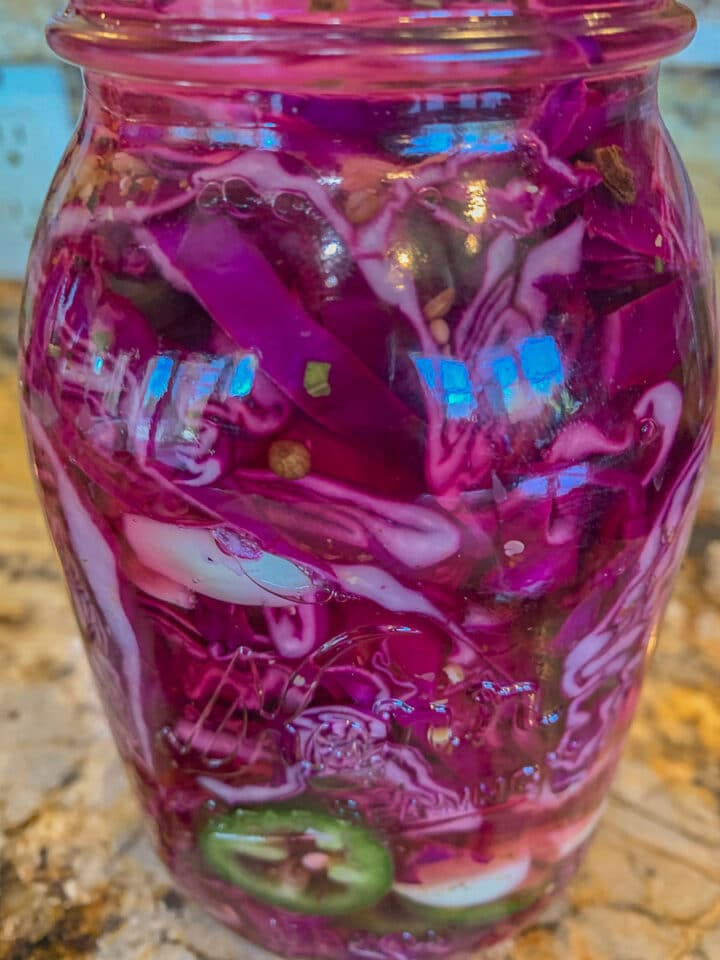 a jar of red pickled cabbage