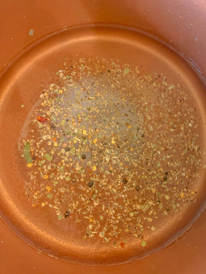 picking spices in liquid