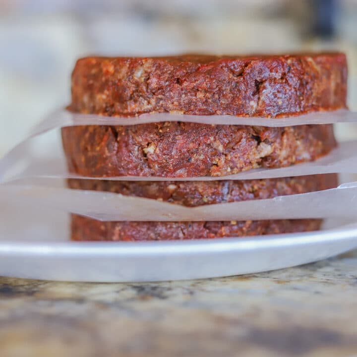 stacked raw venison burgers