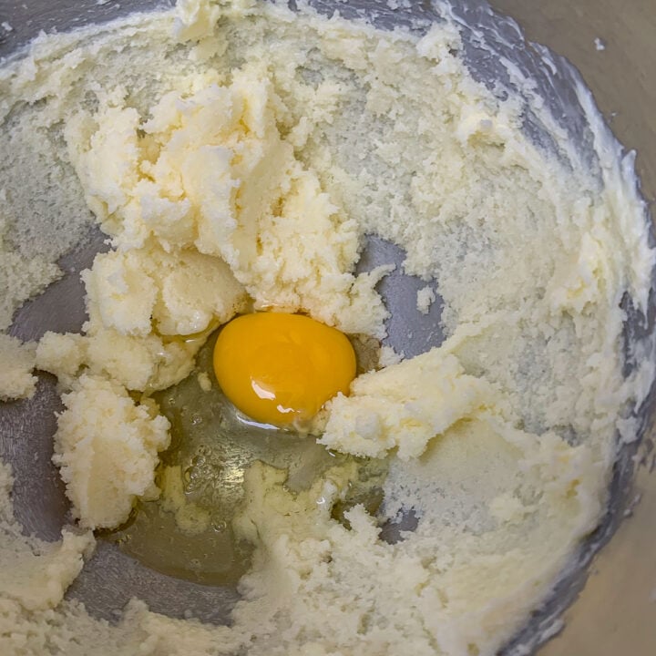 egg in the center of creamed butter and sugar