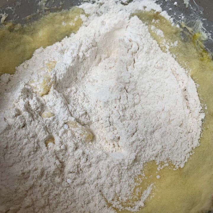 flour added to batter in a bowl