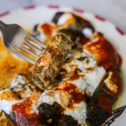 iraqi dolma recipe with sauce over it