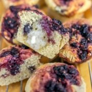 mulberry muffins with one sliced in half with butter