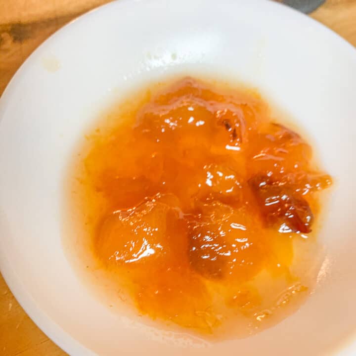 peach preserves in a small white plate