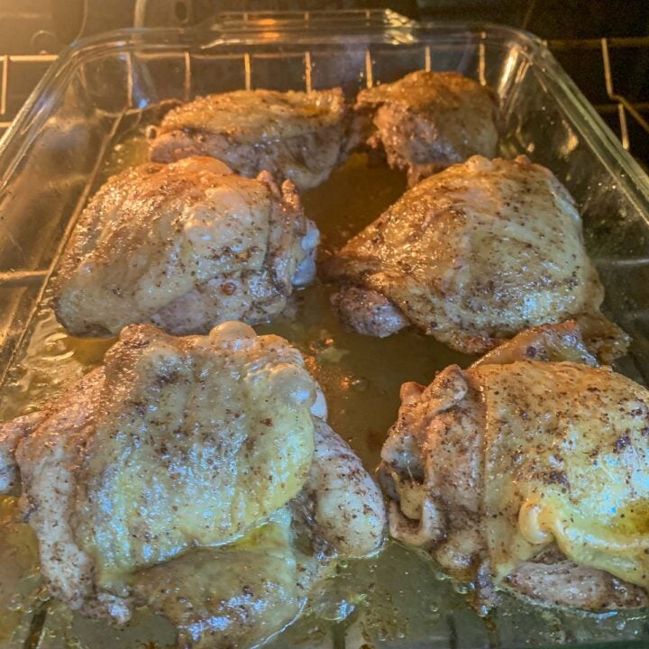 chicken being baked in the oven for Musakhan recipe