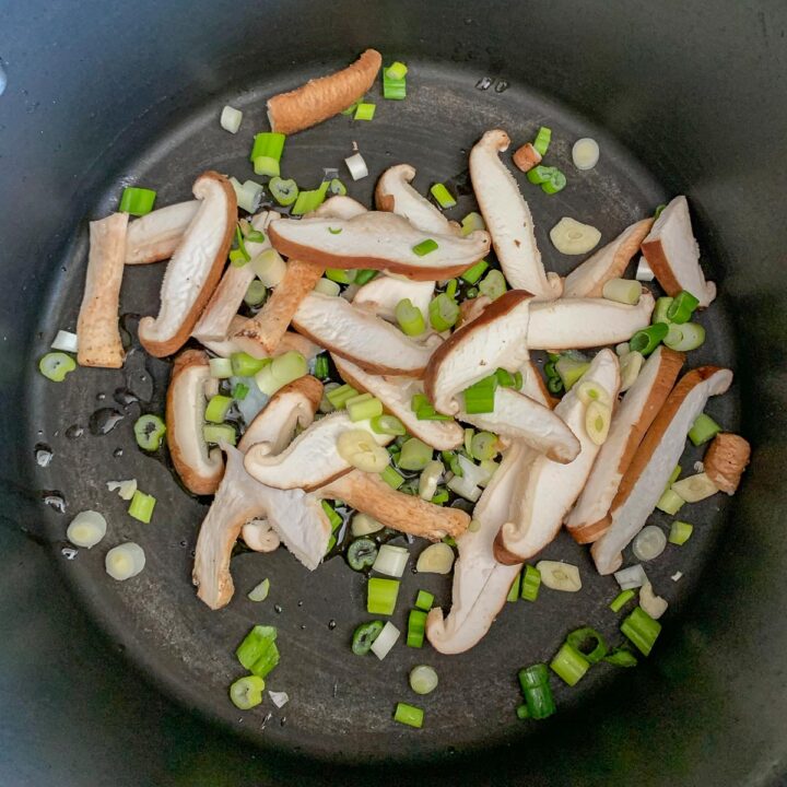 mushrooms and scallions in a pot