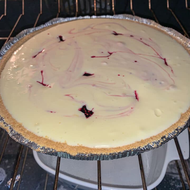 unbaked mulberry cheesecake in the oven