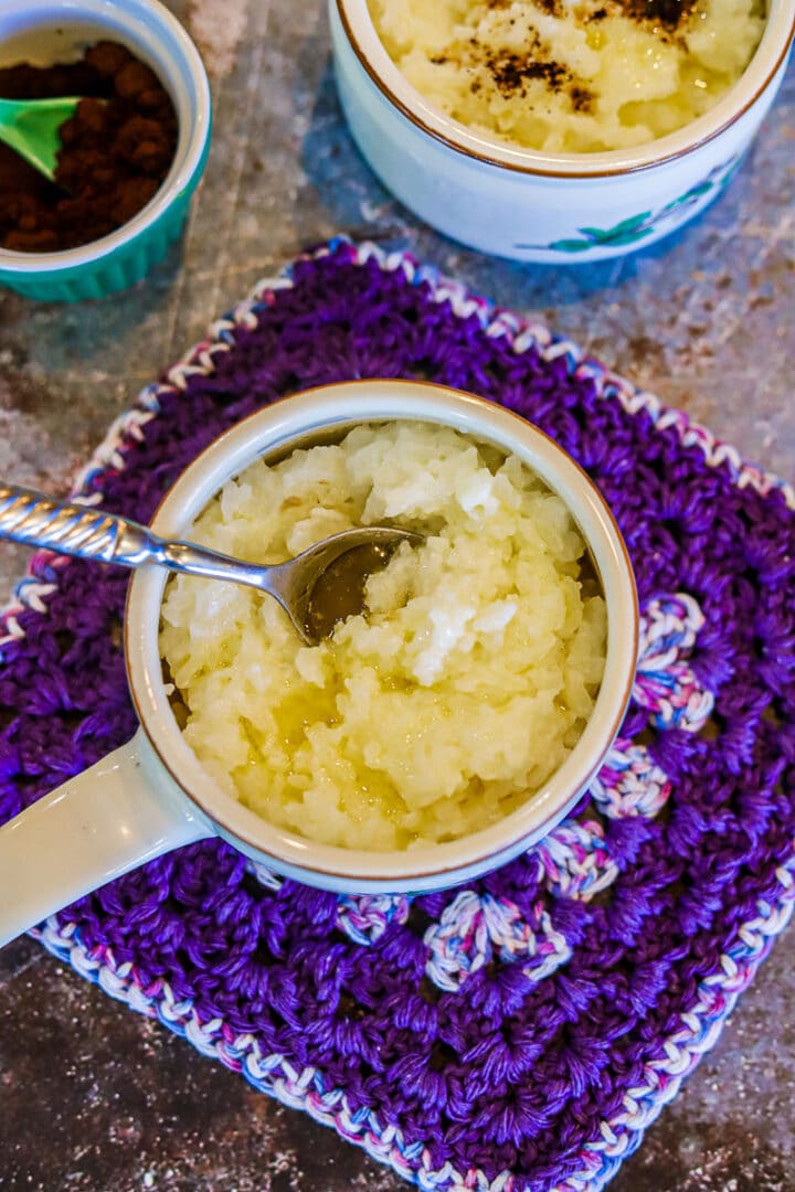yogurt rice (girdoo) on a purple Doyle with fixings on the side