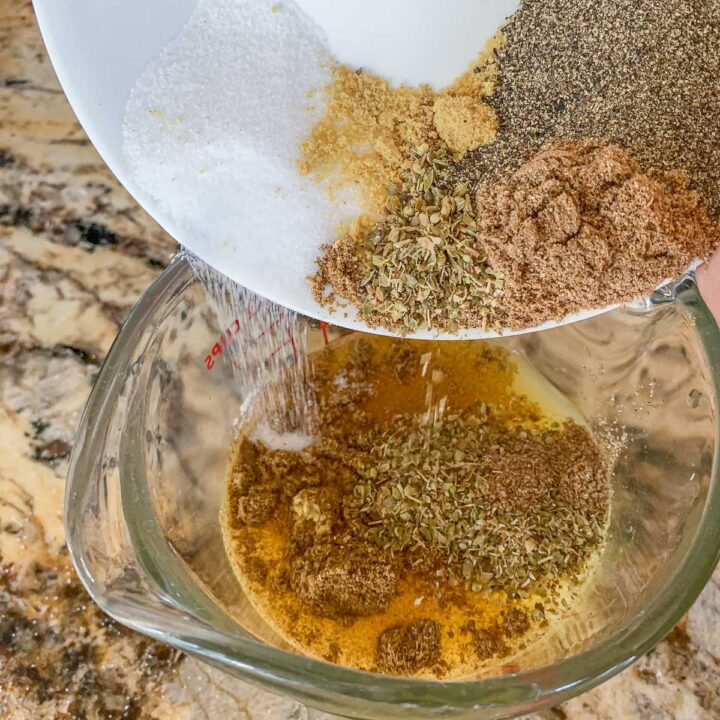 pour spices into a measuring cup