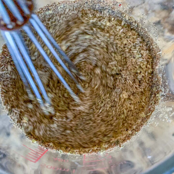 wwhisk spices into broth