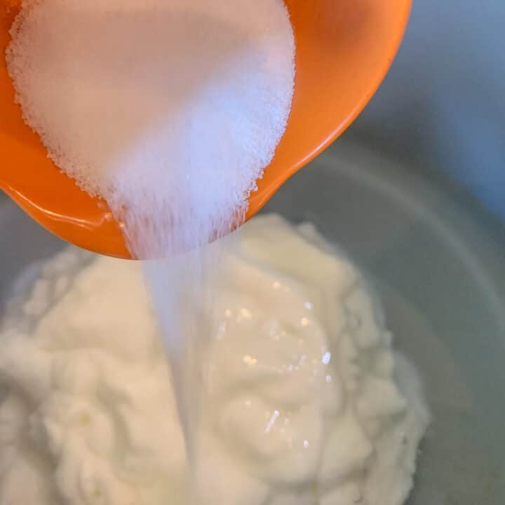 pouring salt on yogurt