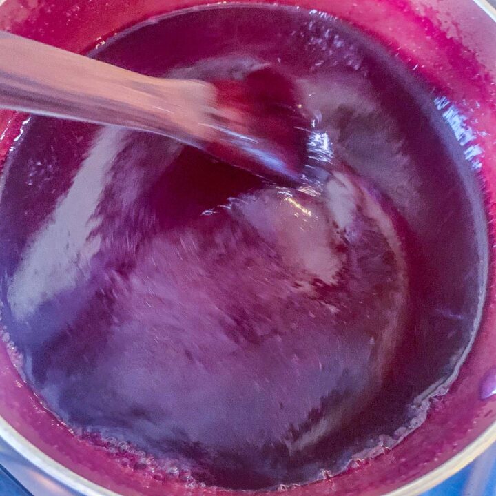 stirring chokecherry jelly
