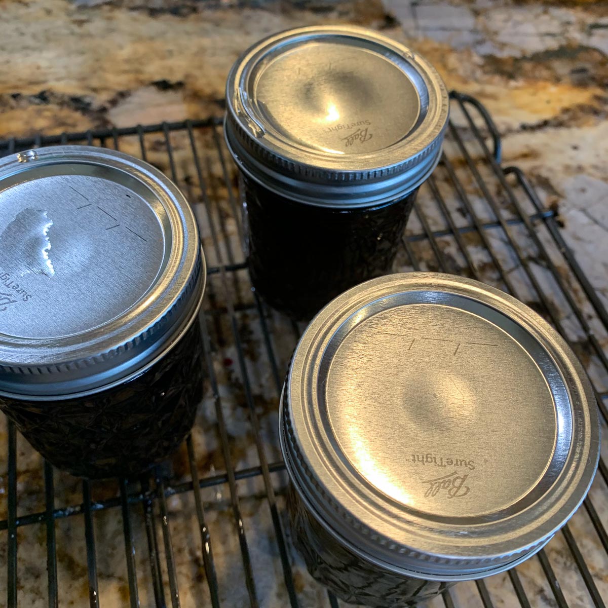 3 jars of jam on the counter