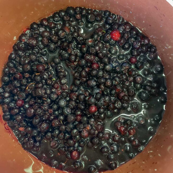 berries being cooked in a pot