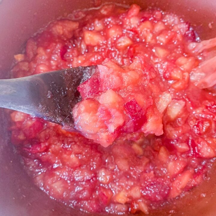 spooning jam out of a pot