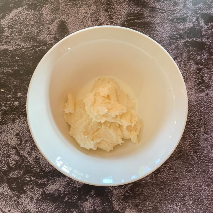 white frosting in a white bowl